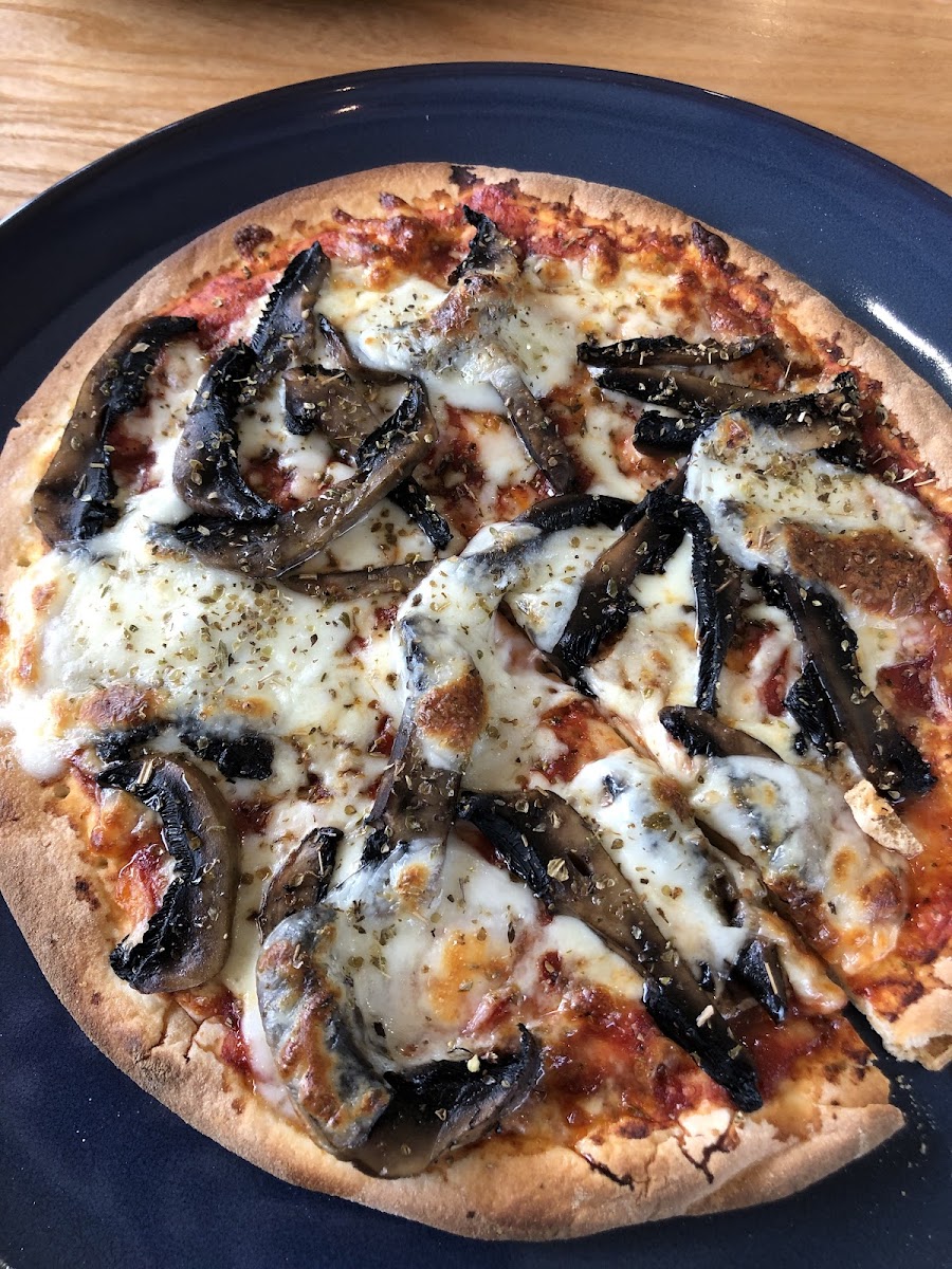 Mushrooms & truffle oil on glutenfree margharita base