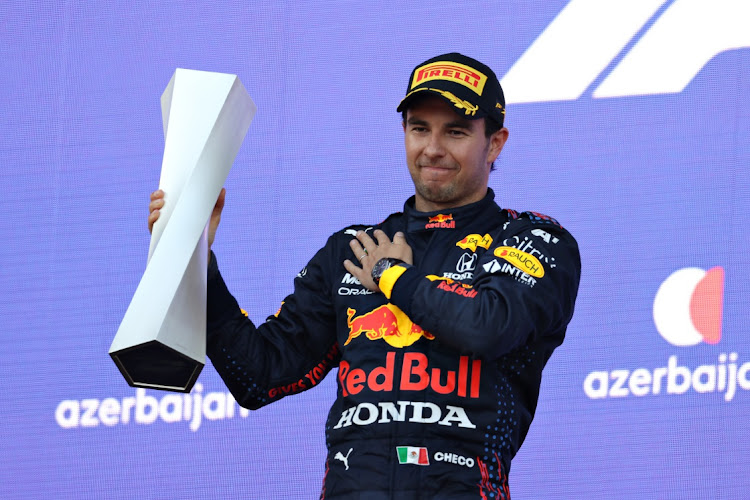 Sergio Perez of Mexico and Red Bull Racing celebrates on the podium after the F1 Grand Prix of Azerbaijan at Baku City Circuit on June 6, 2021 in Baku