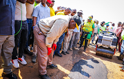 President Cyril Ramaphosa inspects a road repair in Delmas, Mpumalanga.