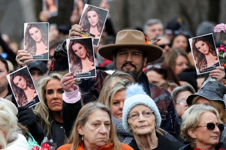 Music fans attend a public memorial for singer Lisa Marie Presley, the only daughter of the 'King of Rock 'n' Roll' Elvis Presley, at Graceland mansion in Memphis, Tennessee.