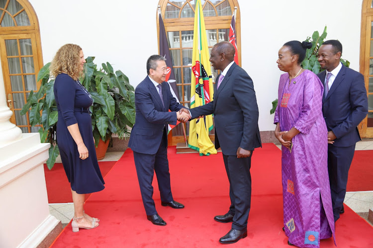 Special envoy of the United Nations Secretary General to the Great Lakes Region Huang Xia and President William Ruto at State House, Nairobi on Friday, November 11, 2022.