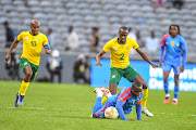 Bafana Bafana defender Nyiko Mobbie in a tussle for the ball with Akolo Ababa Chadrack of DR Congo during their international friendly match at Orlando Stadium on September 12 2023 in Johannesburg.