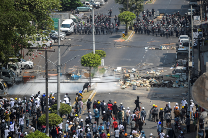 Demonstrators clash with riot police officers during a protest against the military coup in Yangon, Myanmar, on February 28, 2021.