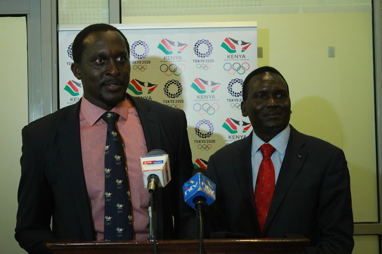 Humphrey Kayange (L) with National Olympic Committee of Kenya president Paul Tergat during the 2019 AGM on November 29 in Nairobi.
