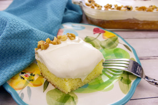 A slice of cream cheese cake on a plate.