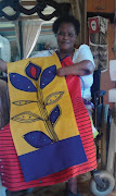 Bolekwa Salusalu makes a living from sewing, despite losing three limbs.