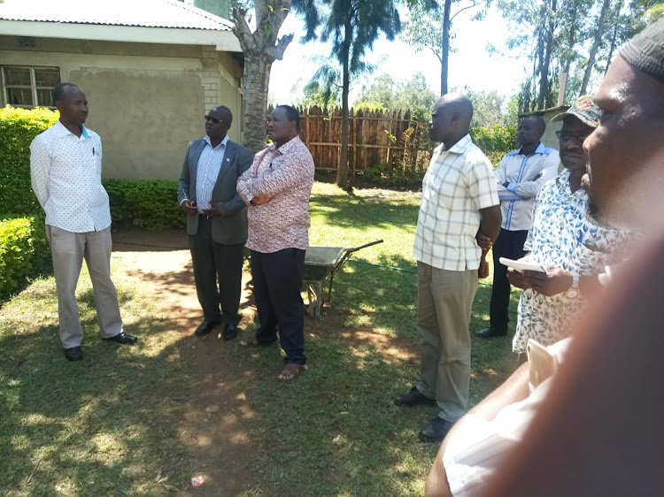 Bumula MP Mwambu Mabonga with friends after a raid on his home on March 28, 2019.