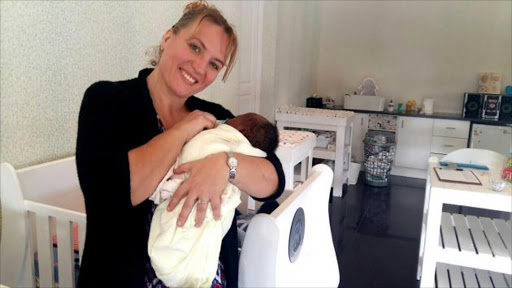 SECOND CHANCE: Elaine Brenkman has opened a new safety centre for babies called Guardians of Hope Place of Safety in Bonnie Doon which cares for abandoned or given up babies until their parents come forward to claim them or they are adopted. Picture: BARBARA HOLLANDS