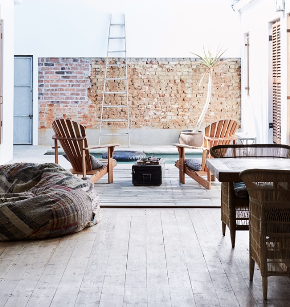 The main living area and two of the bedrooms open onto a central pool courtyard.