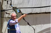 Matthias Schmale, UNRWA's Gaza director, gestures as he inspects the damage at UNRWA'S headquarters, in the aftermath of Israeli air strikes, in Gaza City on May 18 2021. 
