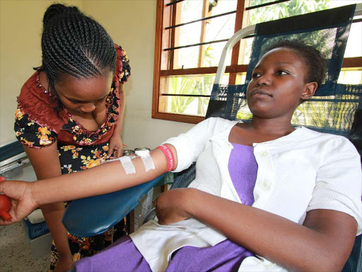 Stella Awinja, 21, a student at Moi University, donates blood at Mombasa blood centre. /FILE