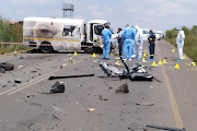 Police at the scene after a cash delivery vehicle was attacked on the R42 in Delmas, Mpumalanga, on Monday. Two suspected robbers were killed and two arrested after the attack.