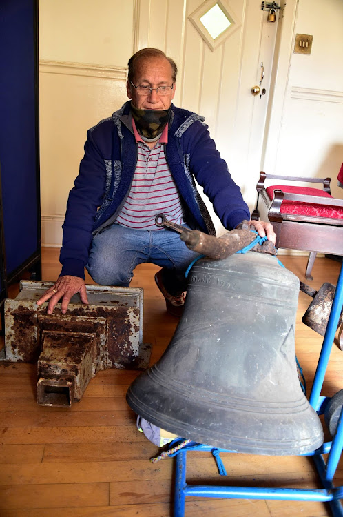 Willie Gere with the bell recovered after an earlier act of vandalism at the St Cuthbert’s Church, in Westbourne Road, Central. Other metal objects were also found hidden in the church’s garden