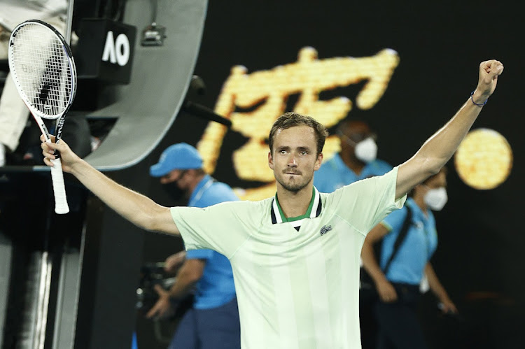 Daniil Medvedev celebrates a match point during his men's singles quarterfinals match against Felix Auger-Aliassime on day 10 of the Australian Open at Melbourne Park on January 26 2022.