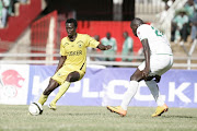 Jesse Were of Tusker controls the ball under pressure from a Gor Mahia player during their DSTV Super Cup match at the Nyayo National Stadium on 23 February 2013. Gor won 5-4 on penalties after a 0-0 in regular time. 