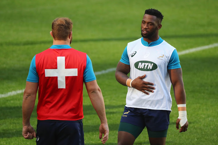 Springbok captain Siya Kolisi (R) chats to Duane Vermeulen (L) during the Rugby International match betwen South Africa and England at Cape Town Stadium, Cape Town on June 18 2018.