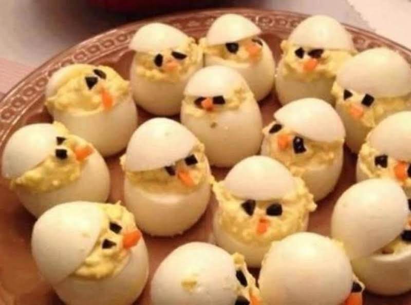 Here Is A New Spin On Deviled Eggs! 
Use Black Olives For Eyes And A Carrot Sliver As The Beak... How Cute Is That!!!
