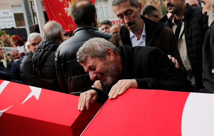 Abdi Koseoglu, father of Mukaddes Elif Topkara and father-in-law of Adem Topkara, two of the six victims of Sunday's blast that took place on Istiklal Avenue, mourns during their funeral ceremony in Istanbul, Turkey, November 14 2022. Picture: REUTERS/DILARA SENKAYA