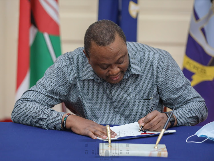 President Uhuru Kenyatta has this evening when he signed into law the 2020/21 Budget, the 2020 Finance Bill and the 2019/20 Third Supplementary Budget.at State House, Nairobi on June 30, 2020.