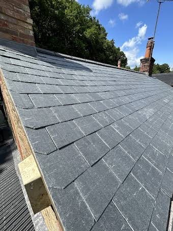 New slate roof, chimney rebuild and code 6 lead gutter  album cover