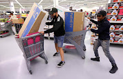 Consumers shop for Black Friday specials. File photo.