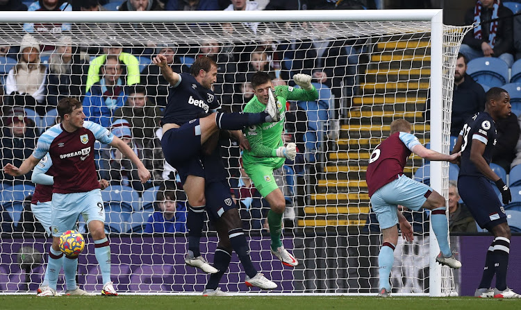 Nick Pope in action against West Ham United's Craig Dawson during his days at Burnley .