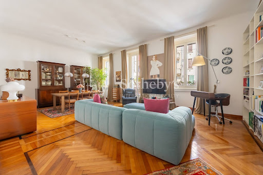 Living room with blue sofa and dining area - Buy this luxury apartment / penthouse in Milan, 4 rooms, 2 bedrooms
