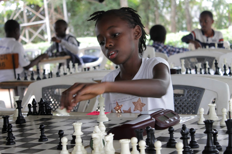 Jawabu School's Imani Maina makes a move during the MiniChess Junior tournament at All Saints Cathedral School on July 13, 2019.