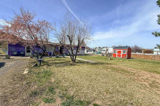 Purple house with red shed in this luxury house for sale in Prineville ($480,000 - 127 m²)