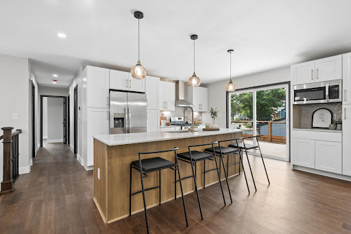 Modern kitchen with island and stools in this luxury property for sale in Westminster ($825,000)