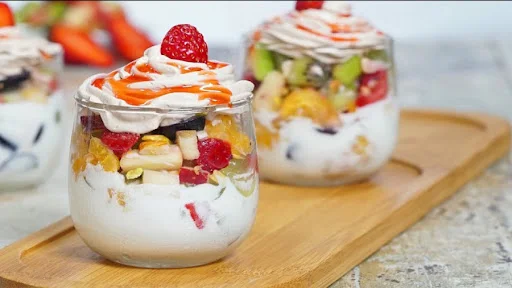 Fresh Fruit Salad With Cream Icecream And Dryfruits