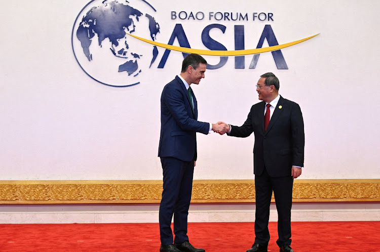 Chinese Premier Li Qiang greets Spanish Prime Minister Pedro Sanchez at the Boao Forum for Asia annual conference 2023, in Boao, China, March 30 2023. Picture: MONCLOA PALACE/REUTERS