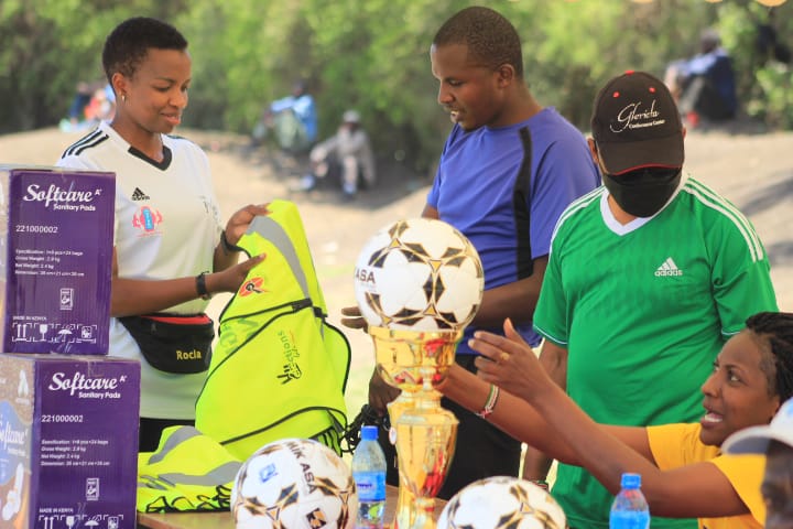 Jackline Saleiyan of A Pack A Month organising the prizes for the winners during the A Pack A Month' I Am Priceless' tournament at the Nakeel Primary School Grounds in Kajiado North on December 31, 2021.