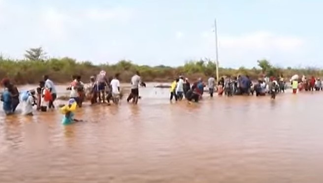 Video showed many of them stranded on top of the semi-submerged vehicle for hours as they waited for assistance.