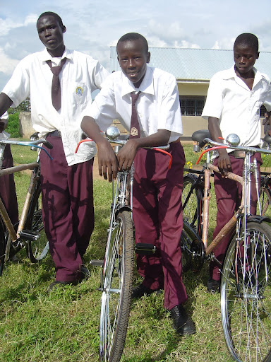 3 proud boys with their bikes