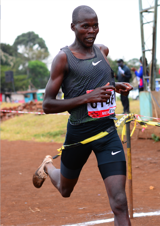 Naibei Kiplimo breasts the tape to win the 10km senior men's race during the AK Nairobi Region Cross Country Championships at Nairobi West Prisons