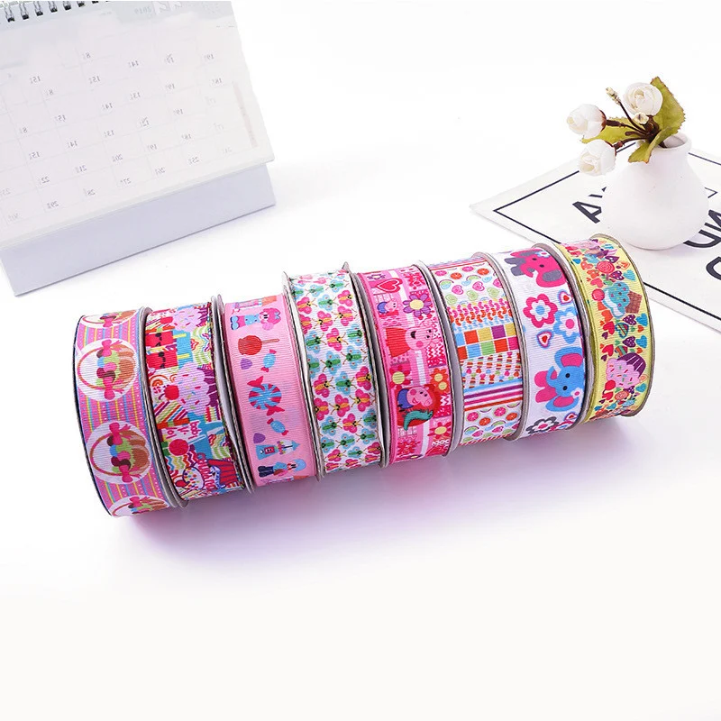 Nastro in poliestere stampato con cartoni animati colorati per artigianato, decorazioni e confezioni regalo. Perfetto per progetti allegri e vivaci.