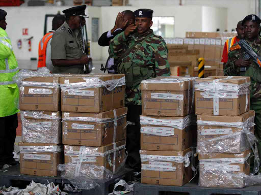 Kenya Wildlife Service (KWS) officials and airport authorities guard a consignment of contraband elephant ivory intercepted at the Jomo Kenyatta airport in Kenya's capital Nairobi, July 25, 2014. Photo/REUTERS