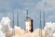 The Long March 5 Y-4 rocket, carrying an unmanned Mars probe of the Tianwen-1 mission, takes off from Wenchang Space Launch Center in Wenchang, Hainan Province, China, on July 23 2020. 