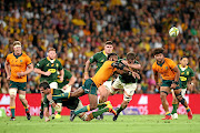 Marika Koroibete of the Wallabies offloads during The Rugby Championship clash against the Springboks at Suncorp Stadium in Brisbane on Saturday.