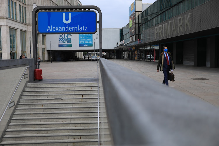 A commuter passes an entrance to Alexanderplatz U-Bahn train station in Berlin, Germany, on May 4 2020. Picture: BLOOMBERG/KRISZTIAN BOCSI