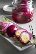 Beetroot eggs with pickled onion.