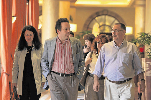 Auditor Lucas Venter with Advocate Billy Downer, right, and former Scorpions team leader Advocate Gerda Ferreira, centre, during a lunch break at the Arms Procurement Commission at the Sheraton Hotel in Pretoria yesterday Picture: KATHERINE MUICK-MERE