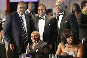 PSL and Orlando Pirates boss Irvin Khoza, left, stands next to then sports minister Fikile Mbalula and Vusi Zwane of Peermont Group during a fundraiser for now late boxer Baby Jake Matlala.