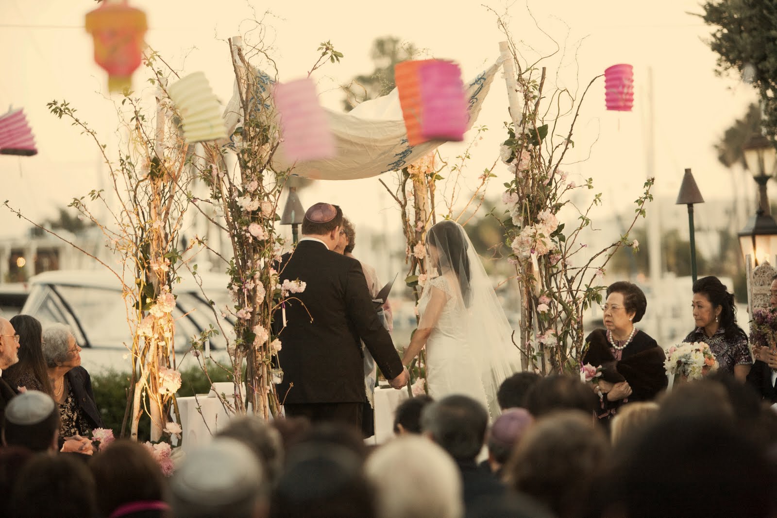 wedding chuppah parents under