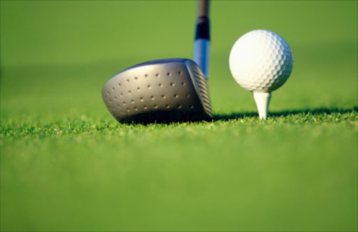 Golf ball on tee with driver. File photo.