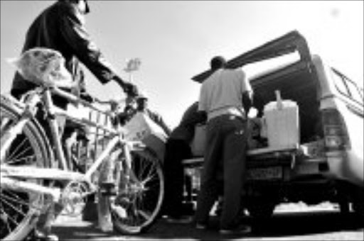 LIVING IN FEAR: Some of the foreigners at Alexandra police station. Pic. Mohau Mofokeng. 15/05/08. © Sowetan.