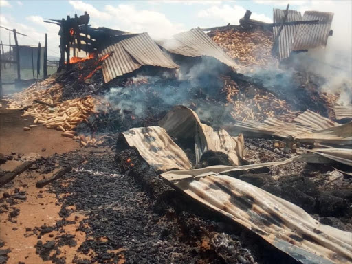 Shops set ablaze at Nkoiben trading centre near Maasai Mau Forest on Thursday. /KIPLANGAT KIRUI