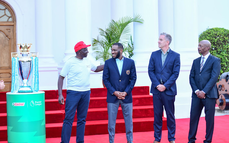 President William Ruto receives EPL trophy at State House.