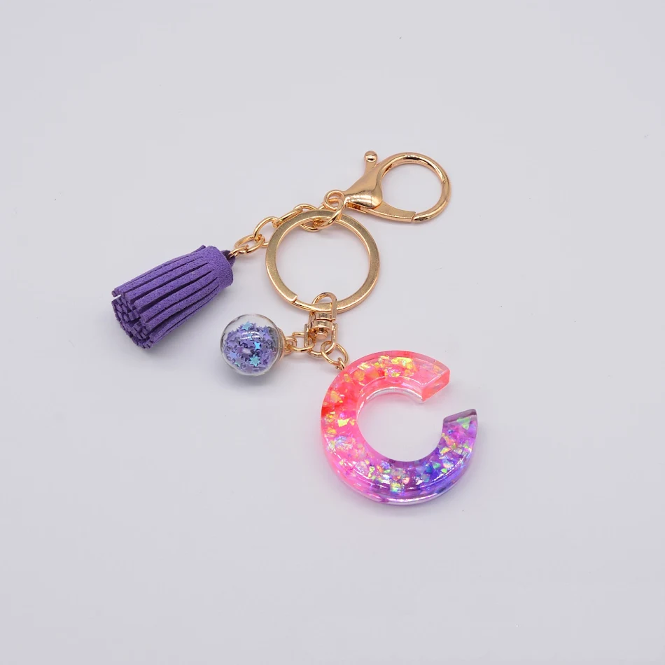 Resin Purple Epoxy English Keychain. A stylish and durable keychain perfect for everyday use. This unique accessory adds
